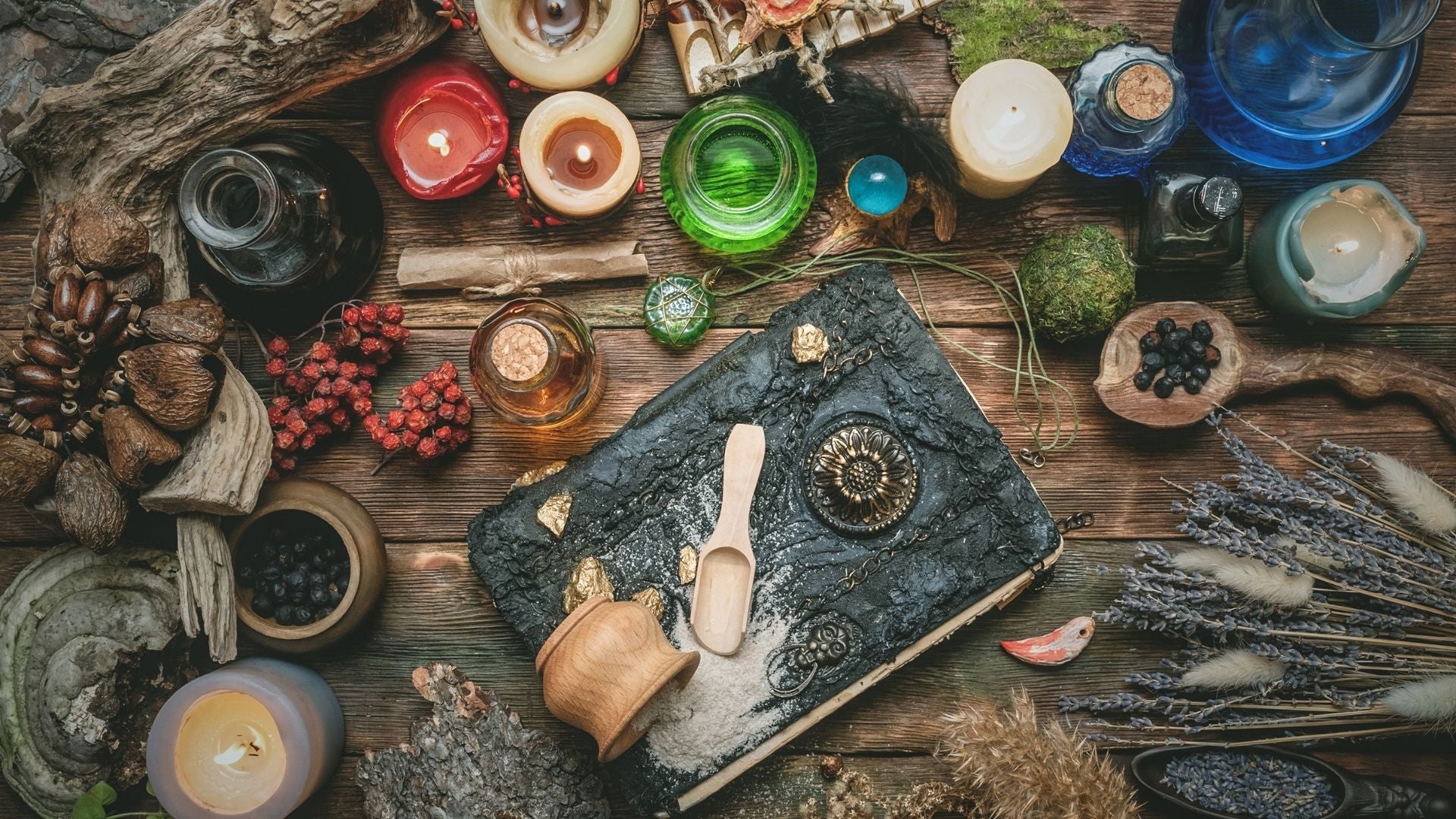 Image showing witchy tools, such as a spell book, herbs, candles, and more. - The Call of the Craft